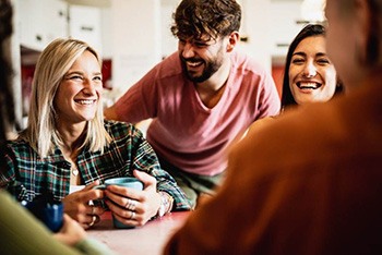 a woman with dentures talking with friends