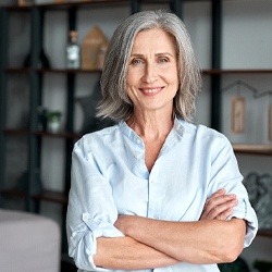 Woman smiling with arms crossed