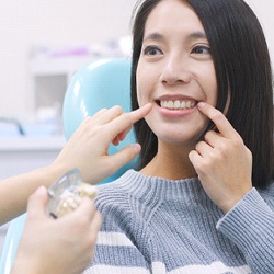 Woman smiling during implant consultation