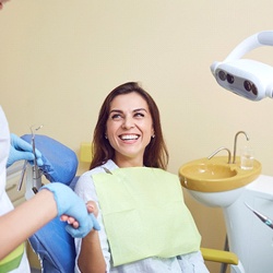 Woman shaking hands with her dentist