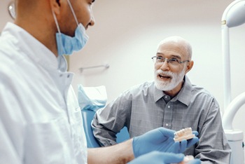 Implant dentist in Temple speaking with a patient