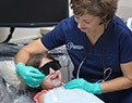Child smiling during preventive dentistry visit