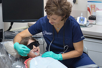 Child smiling during preventive dentistry appointment